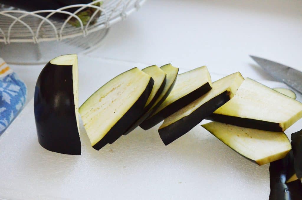 Eggplant slices with the skin on on the counter