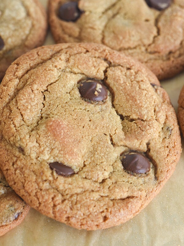 A chocolate chip cookie on parchment paper