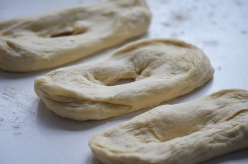 Donut dough shaped into rings.