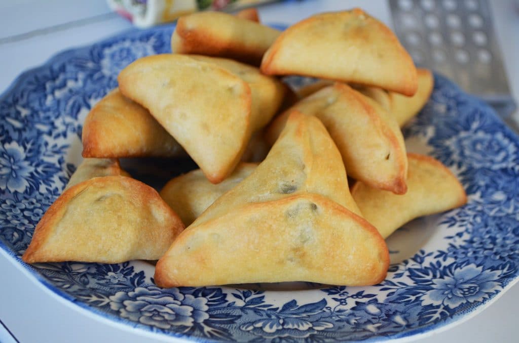 Lebanese spinach pies on a blue floral plate, Maureen Abood