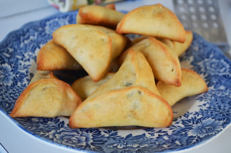 Lebanese spinach pies on a vintage blue plate, by Maureen Abood.com