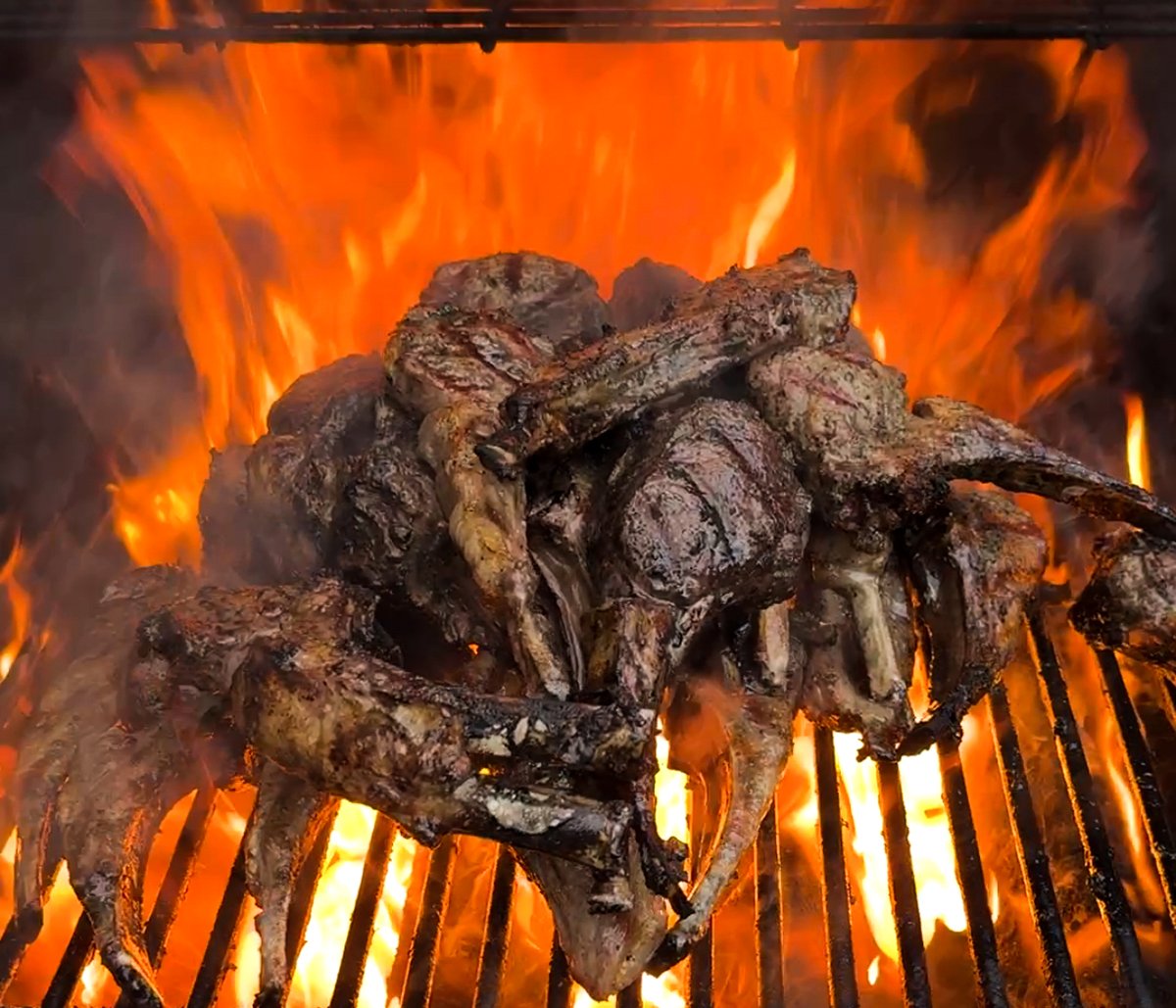 Lamb lollipops on the grill in flames