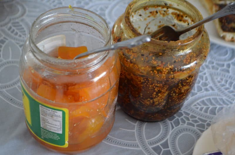 A jar of Lebanese fig jam next to another jar of preserves.