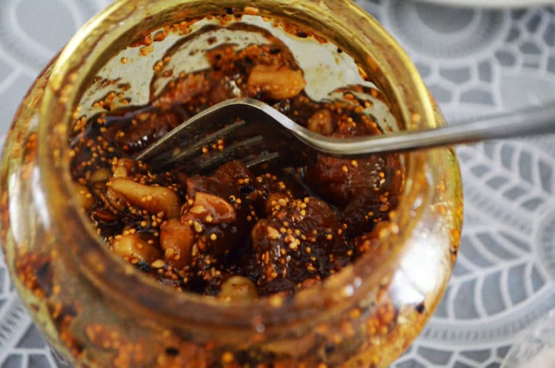 A fork in a jar of fig jam.