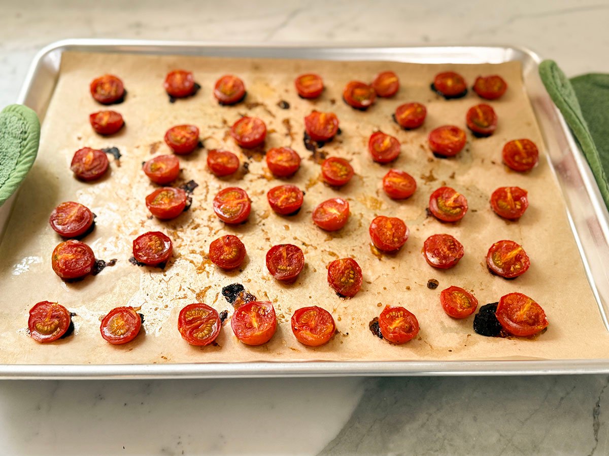 Roasted tomatoes on a baking sheet