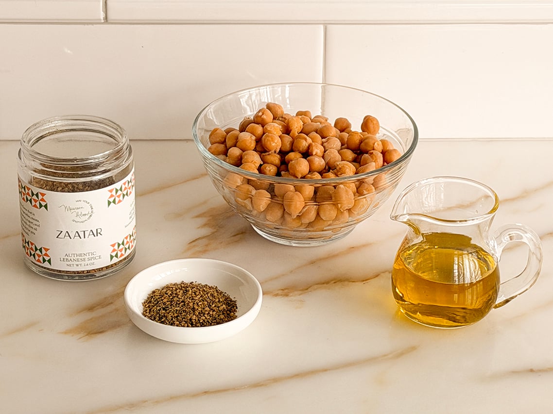 Ingredients for crispy chickpeas on a marble countertop