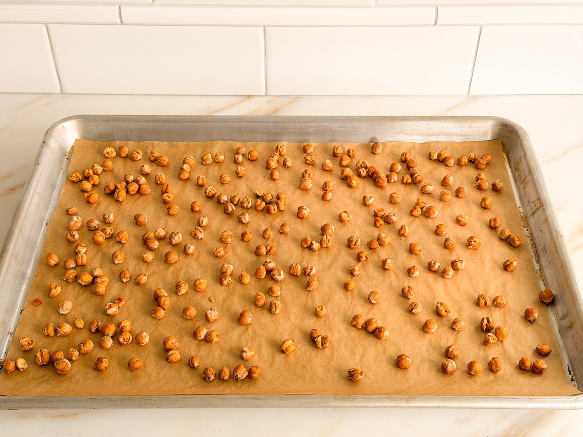 roasted chickpeas spread on a baking sheet