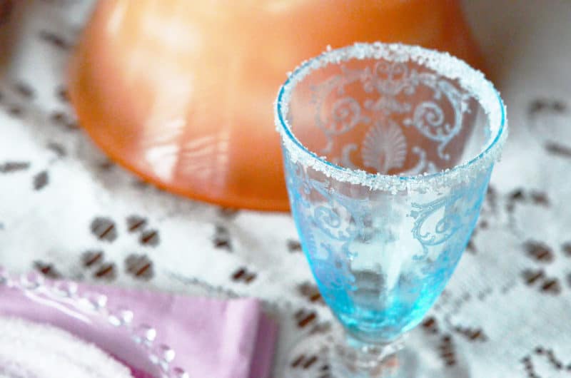 An empty glass rimmed with sanding sugar.