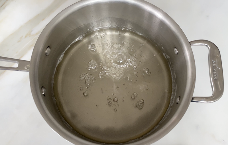 simple syrup simmering on low heat in a pot