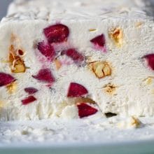 Loaf of ice cream studded with cherries and nuts