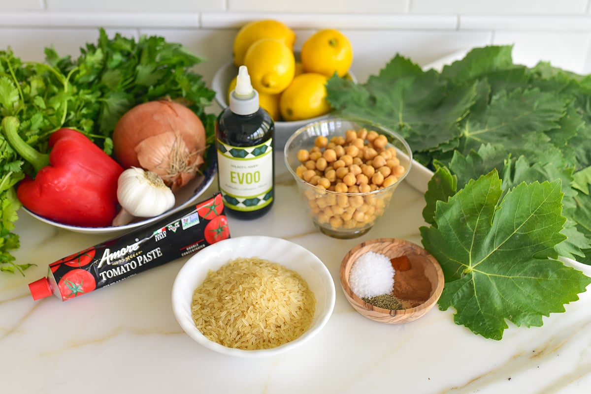 ingredients for grape leaves on a marble counter