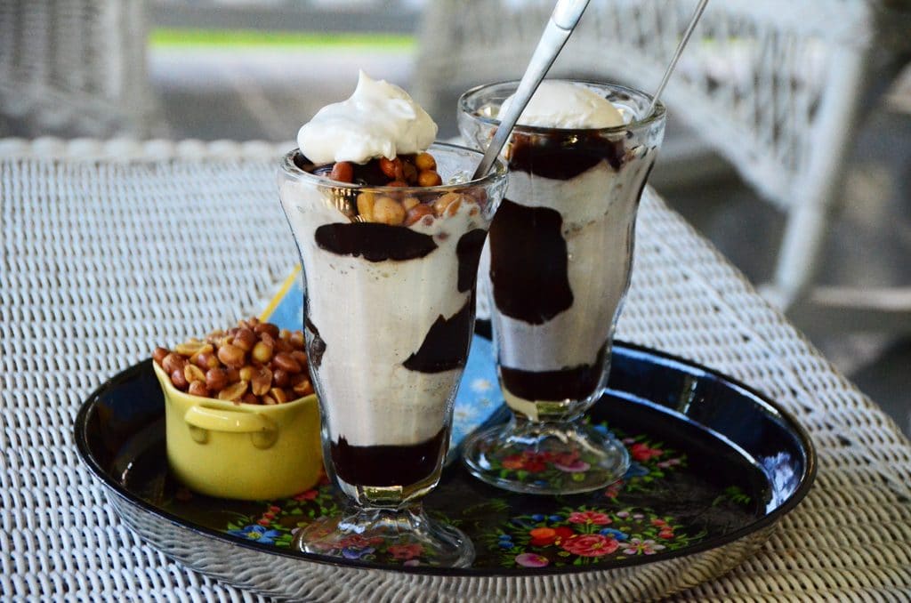 ice cream sundaes with a spoon in them