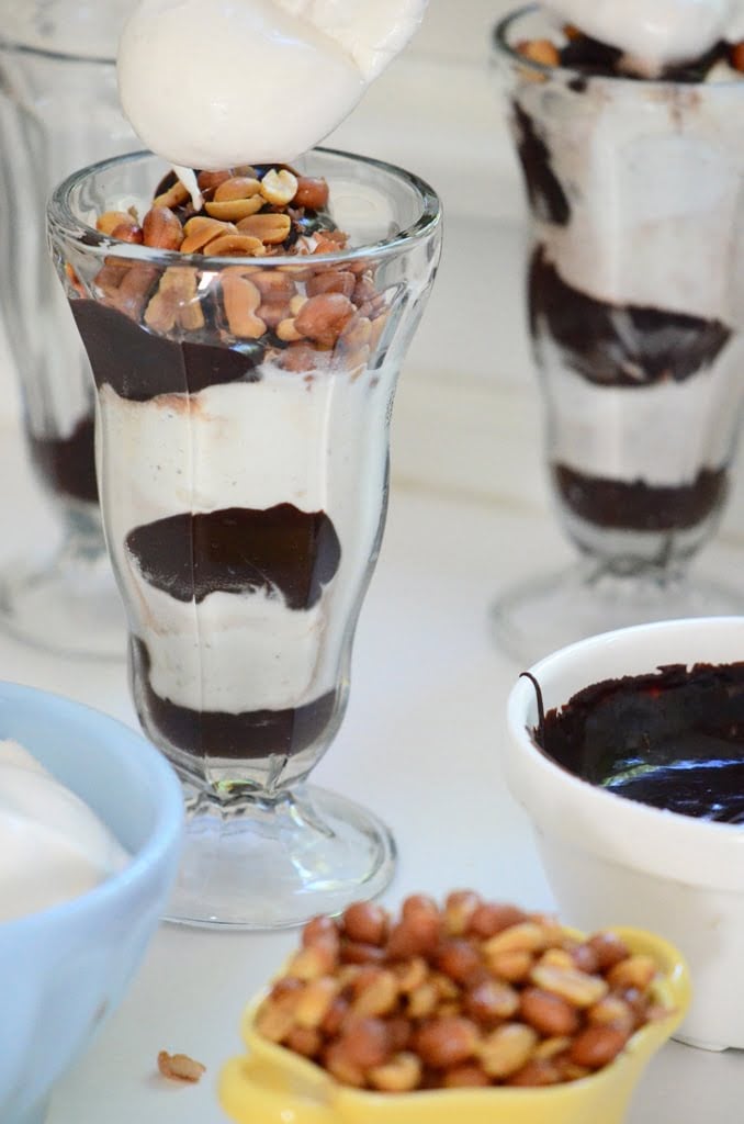 A sundae with hot fudge sauce, marshmallow sauce, and Spanish peanuts