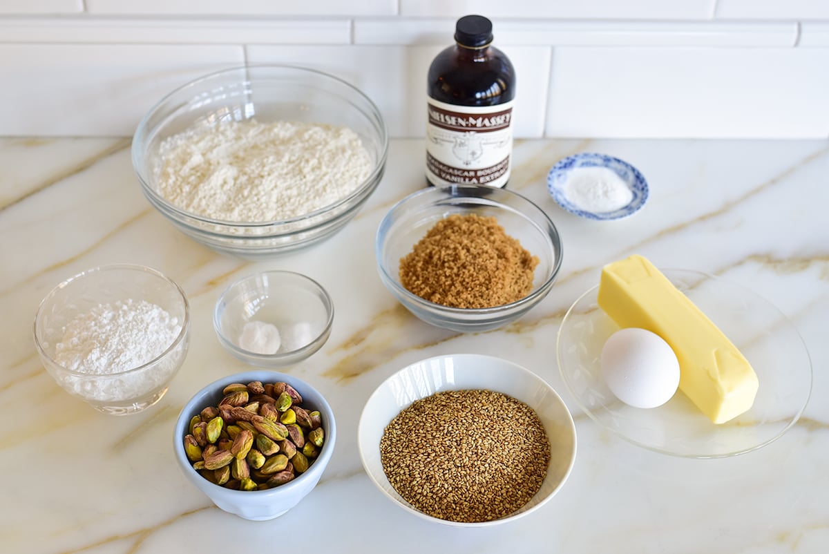 Ingredients for sesame cookies on a marble countertop