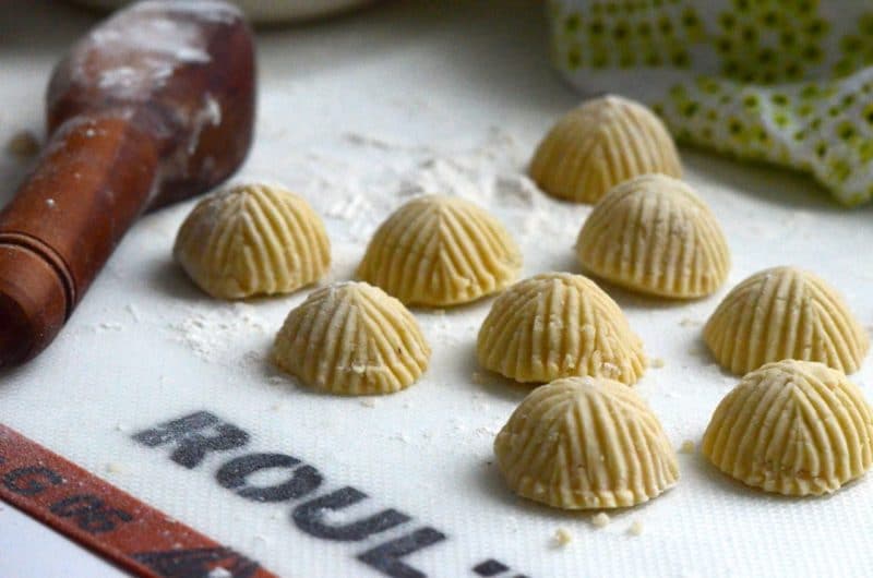 Lebanese cookies resting on a silicone mat, ready to be baked.