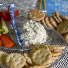 Smoked whitefish dip in a platter with crackers and vegetables