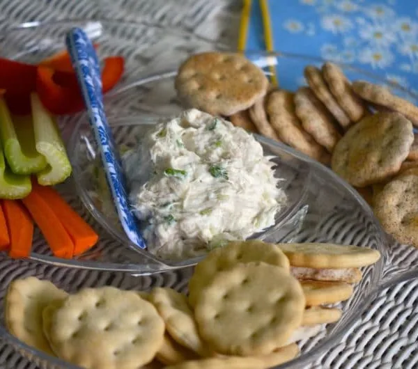 Smoked whitefish dip in a platter with crackers and vegetables