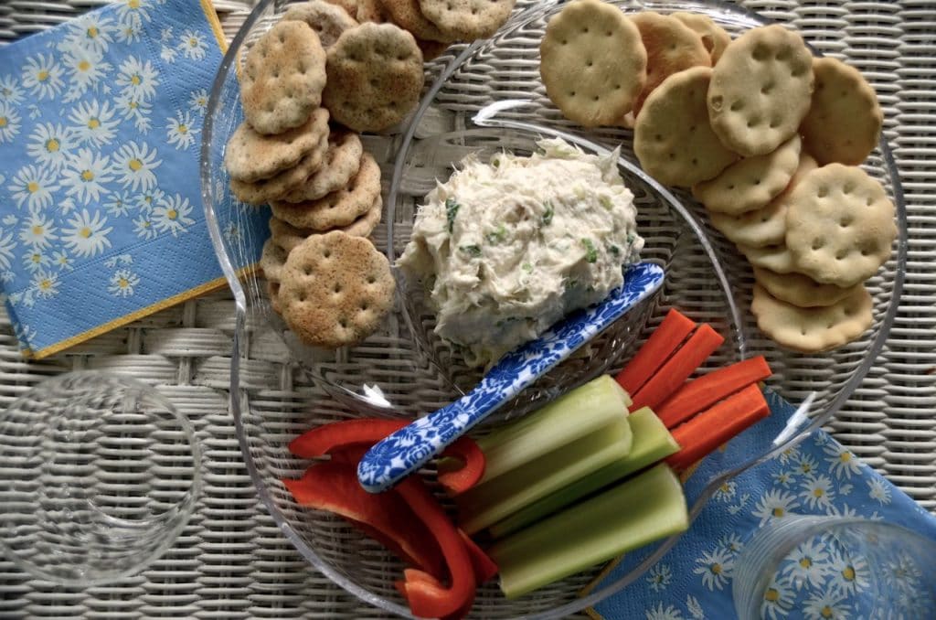 Smoked whitefish dip in a tray with crackers and vegetables