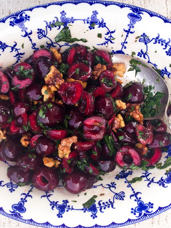 Cherry salad in a blue and white oval bowl