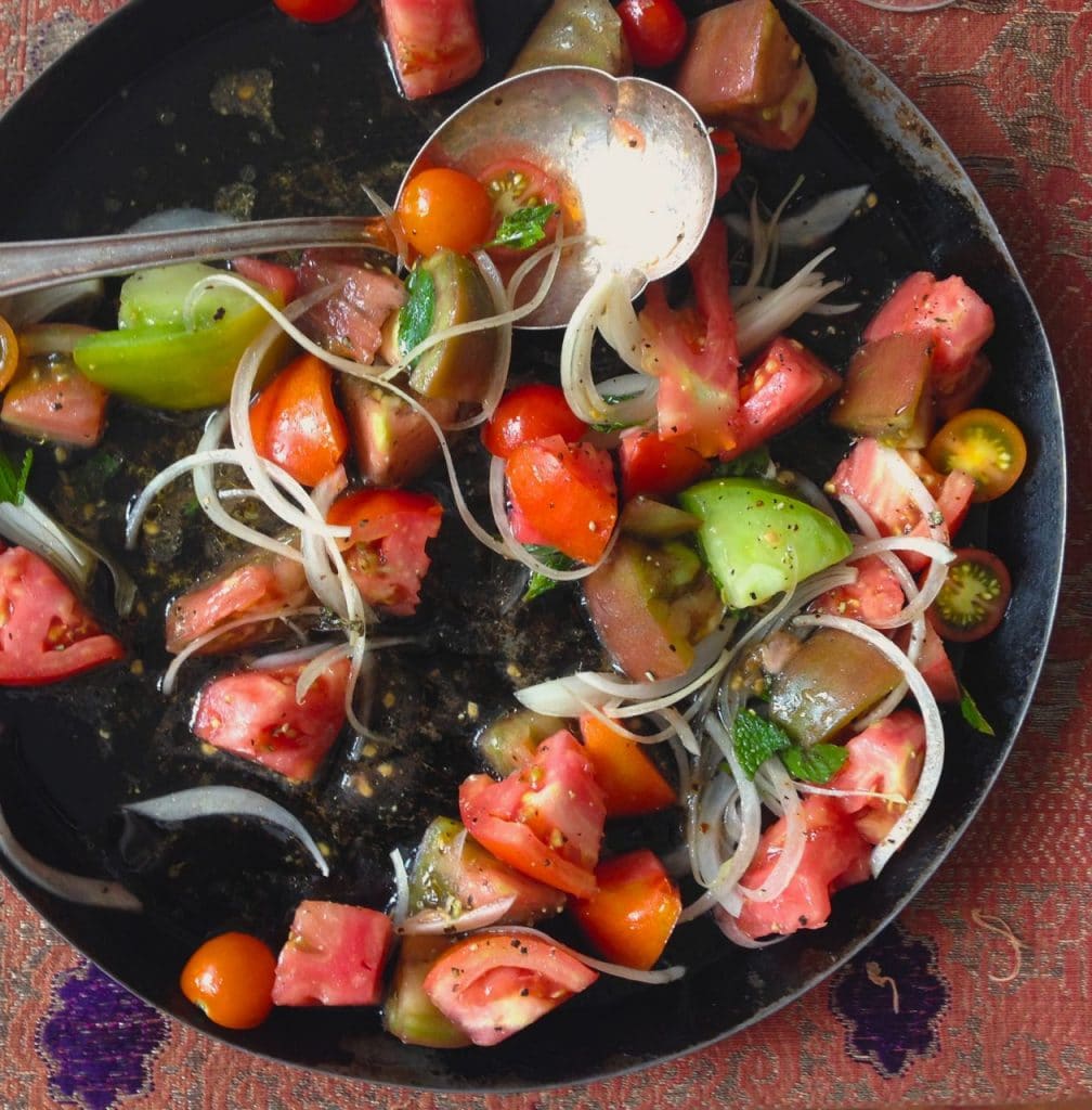 Tomato Salad in a black dish