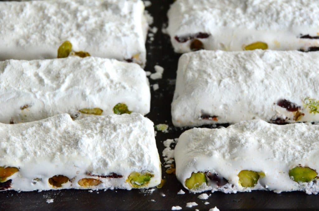 https://maureenabood.com/wp-content/uploads/2014/12/Nougat-slices-on-a-board-Maureen-Abood-1024x678.jpg