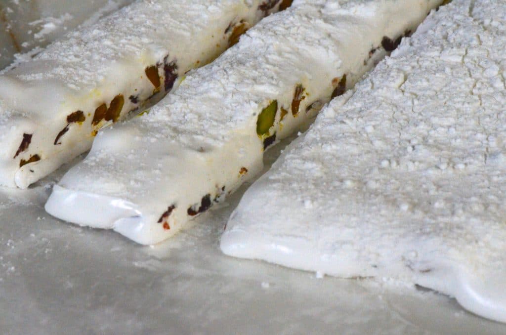 https://maureenabood.com/wp-content/uploads/2014/12/Nougat-slices-on-parchment-Maureen-Abood-1024x678.jpg