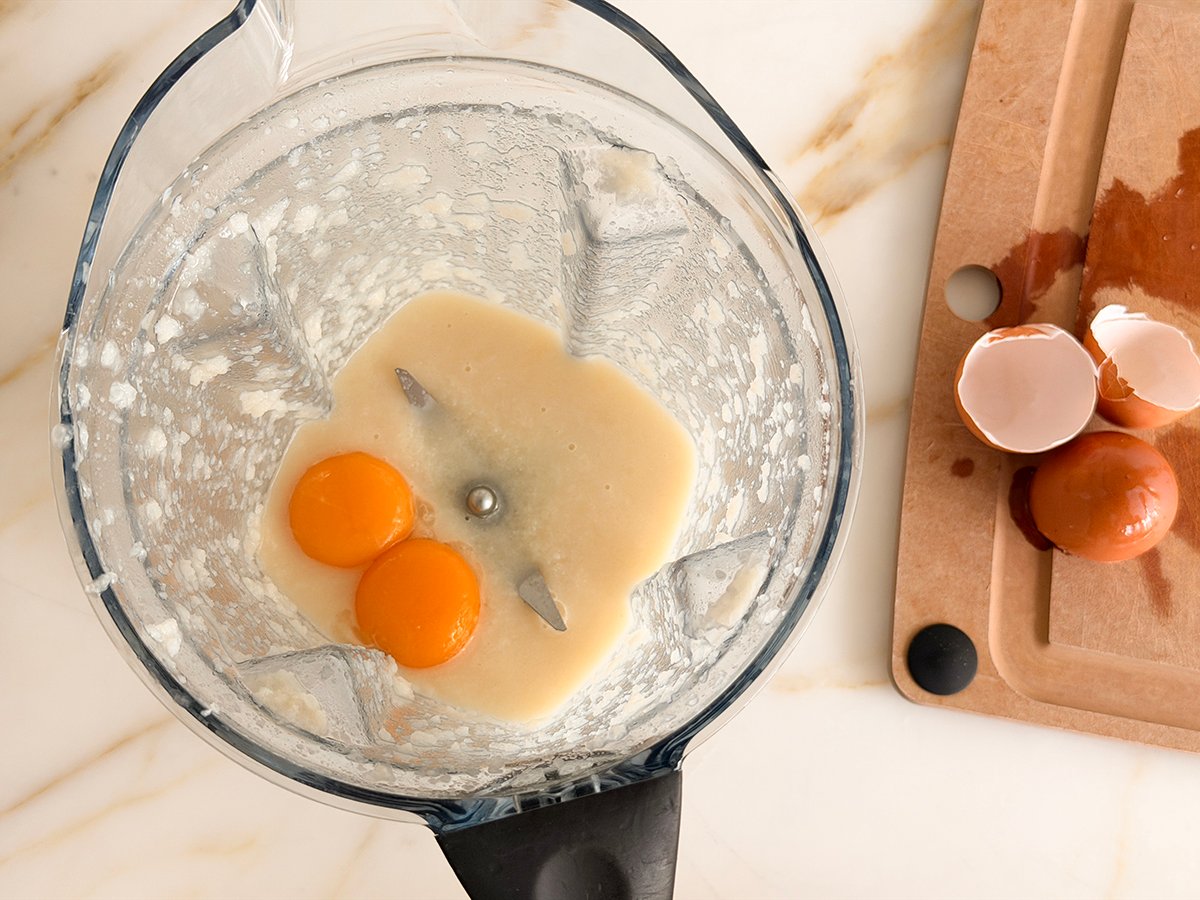 eggs in a blender with egg shells on the side