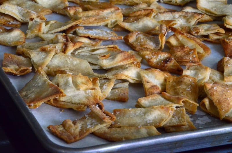 Golden brown pita chips on a sheet pan