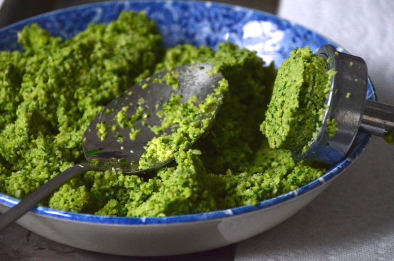 Falafel mix in a blue bowl with falafel scoop