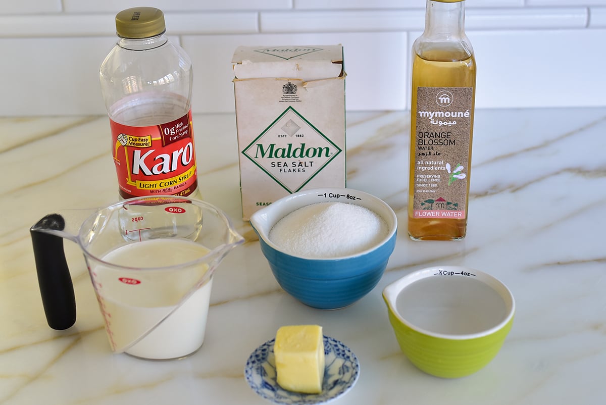 Ingredients for caramel sauce on a marble countertop