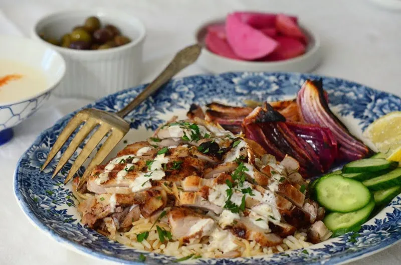 Yogurt marinated chicken on a platter.
