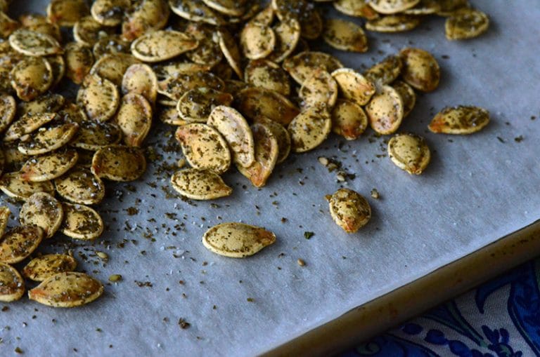 Za'atar roasted pumpkin seeds on parchment paper