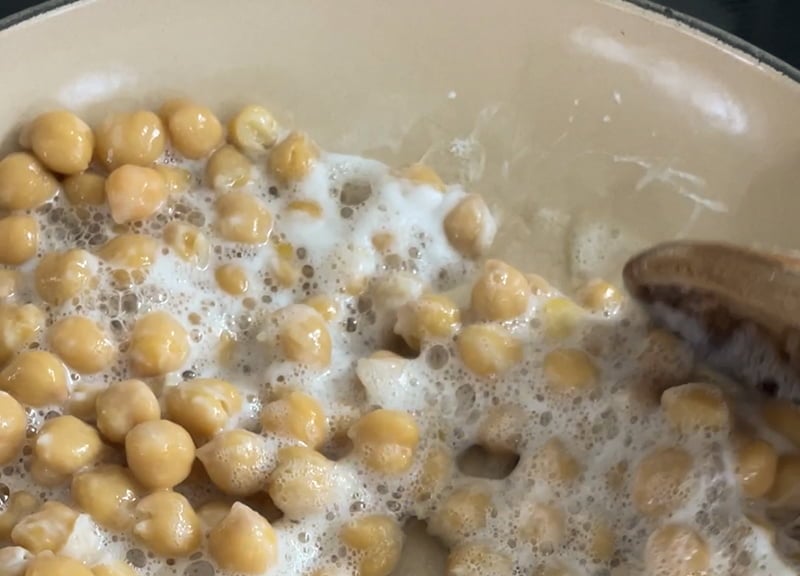 Chickpeas with baking soda in a pan for hummus.