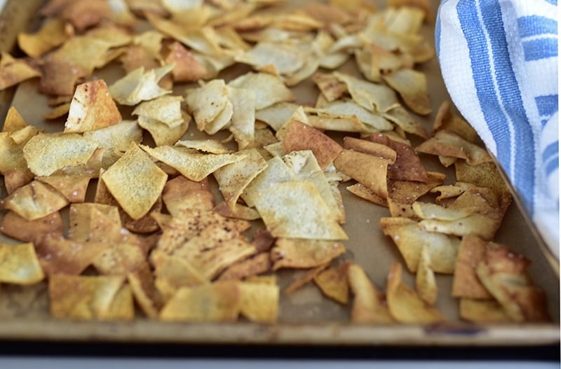 Pita chips on a baking sheet.