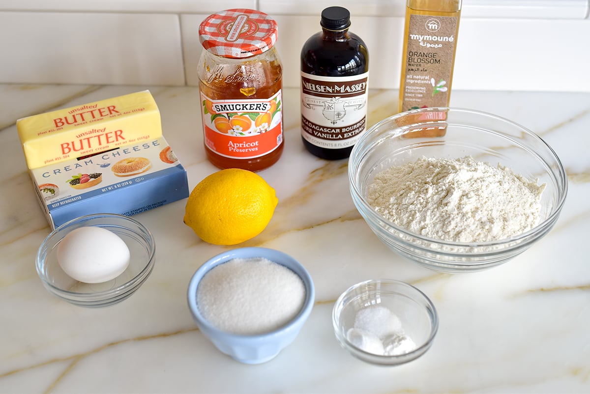 Ingredients for thumbprint cookies on a marble countertop