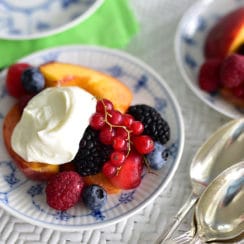 Fresh fruit with ashta cream in a Royal Copenhagen blue dish on a wicker table, Maureen Abood