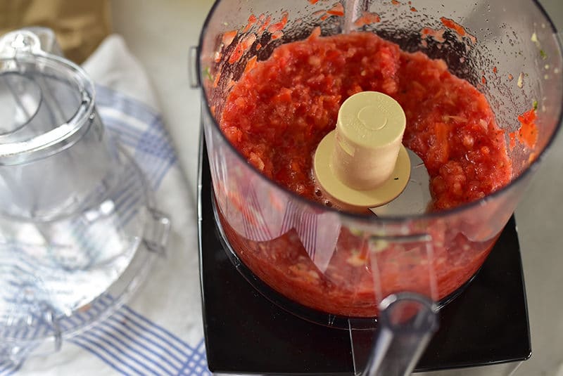 Tomatoes in the food processor with the lid off, Maureen Abood
