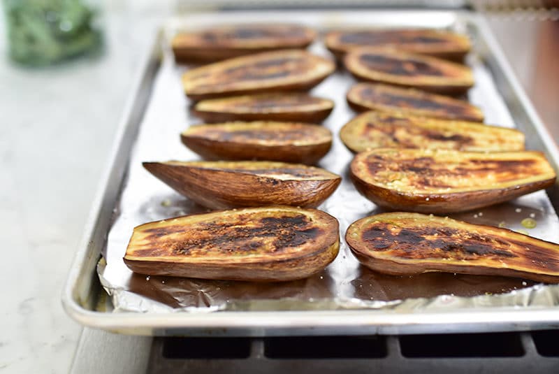 Broiled eggplant halves on a foil-lined sheet pan, Maureen Abood