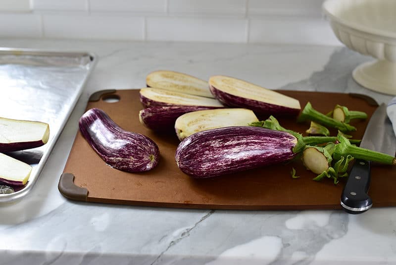 Sliced eggplant on a board with a knife, Maureen Abood