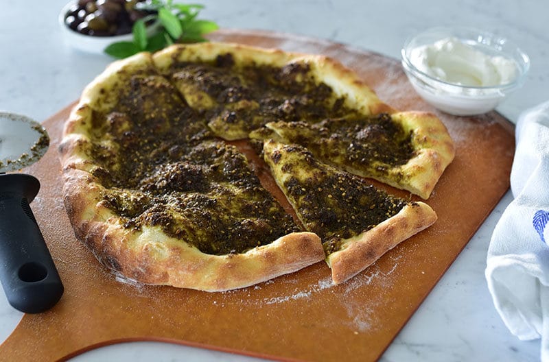 Za'atar flatbread on a pizza peel, Maureen Abood