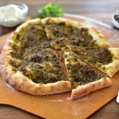 Zaatar flatbread on a pizza peel