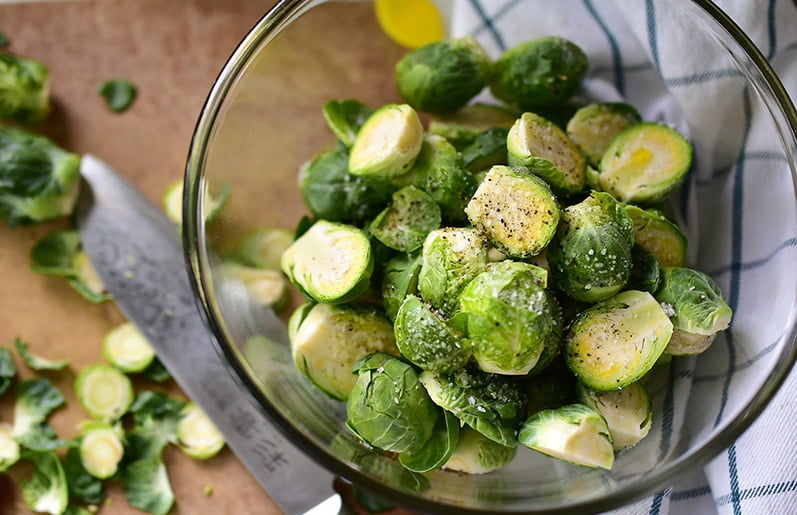 Seasoned brussels sprouts in a glass bowl, MaureenAbood.com