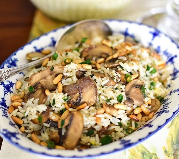 Lebanese rice with pine nuts and mushrooms in a blue bowl