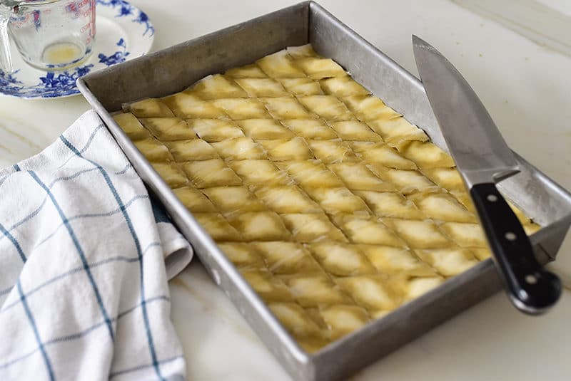 Baklawa diamonds cut in pan and buttered, Maureen Abood