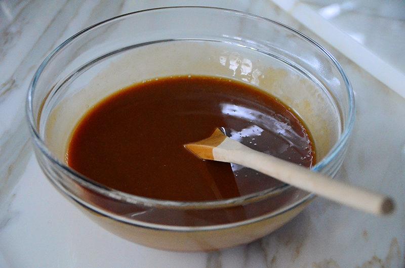 Glass bowl filled with caramel, Maureen Abood