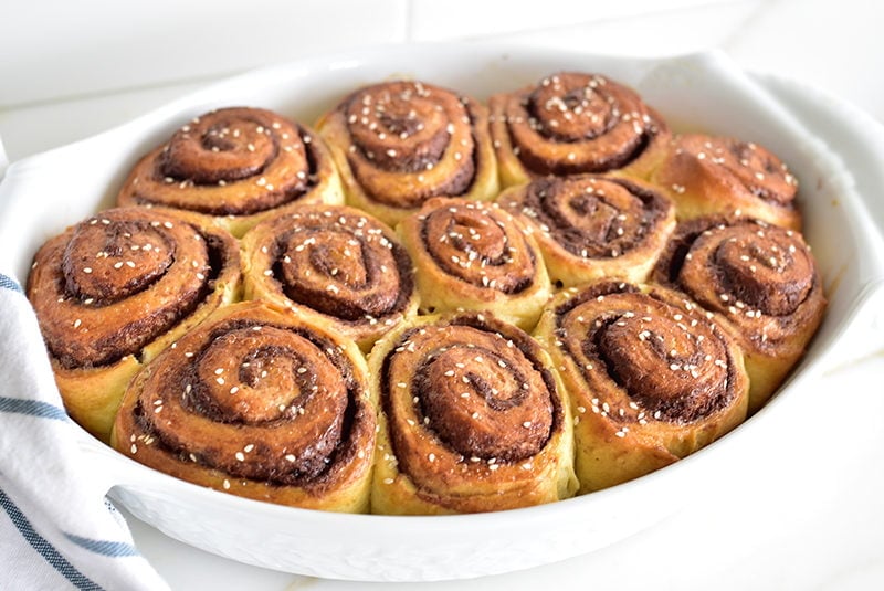 Chocolate Tahini Breakfast Rolls in a beautiful white baking dish