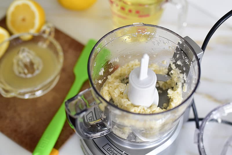 Garlic and lemon juice in a small food processor