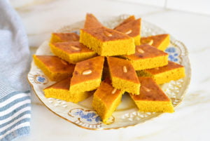 Lebanese Sfouf cake with turmeric cut in diamond-shaped pieces on a white plate