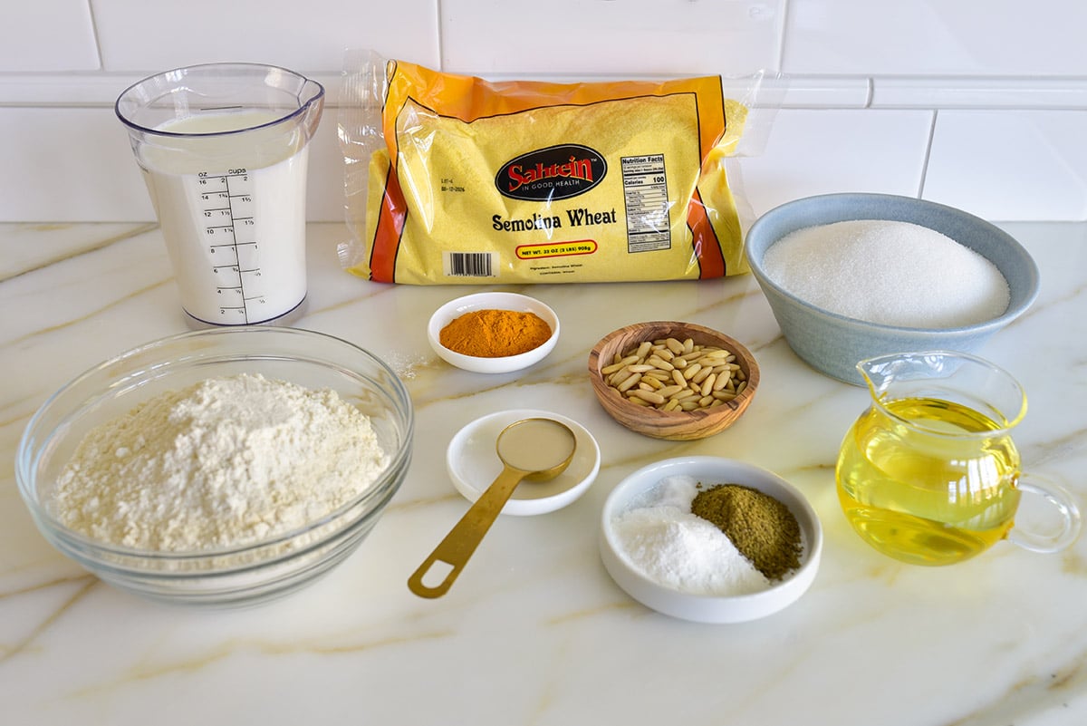 Ingredients for sfouf cake on a marble countertop