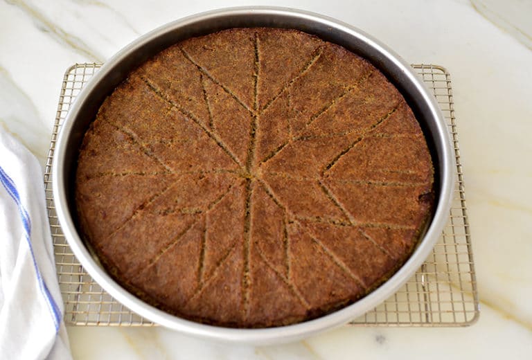 Kibbeh sahnieh in a round pan, cut in diamonds